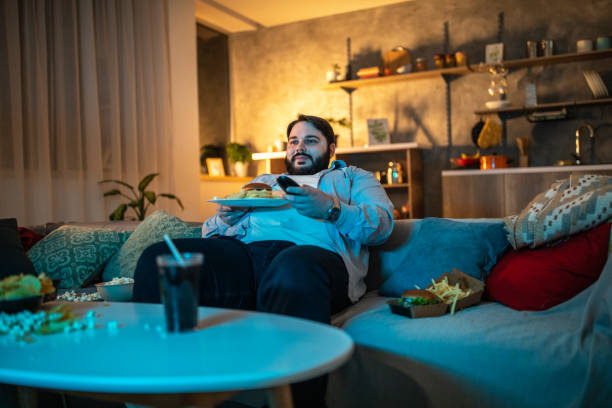 istock Overweight man at home after work 1071471666