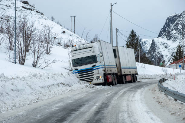 istock Trailer truck accident slippery on snow pavement 1071475300