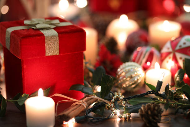 istock Christmas holiday decorations, candles, gift on table. 1071475506