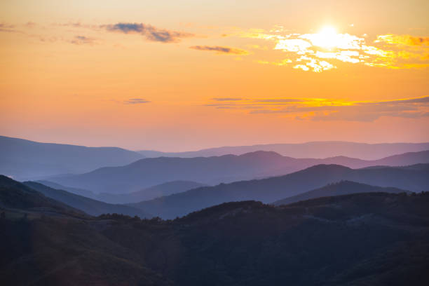 istock mountain valley in a mist at the sunset 1071476812