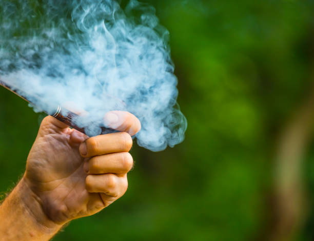 istock man hold smoking pipe in a coils of smoke 1071476892