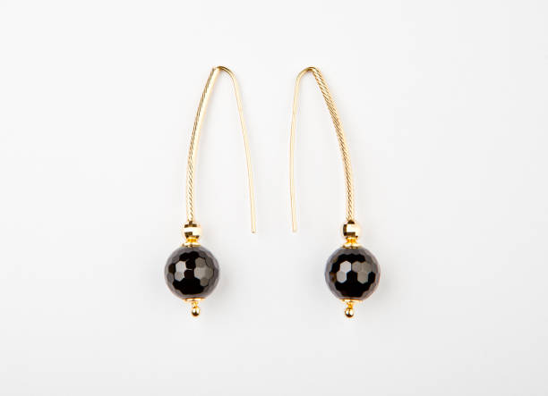 istock hematite stone gold earrings white background nobody 1071479496