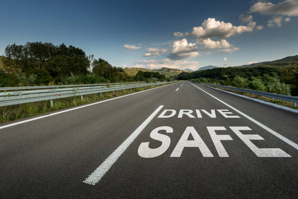istock Drive safe message on Asphalt highway road through the countryside 1071484164