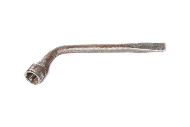 Old car wheel wrench isolated on white