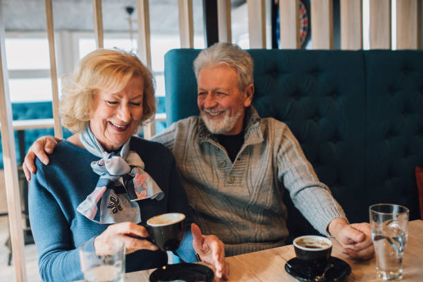 istock Smiling couple drinking coffee 1071500386