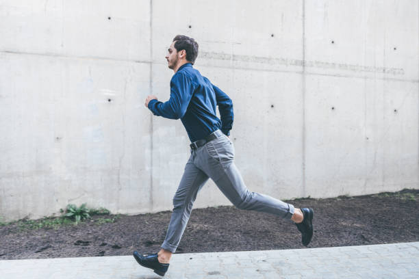 istock young businessman running outdoors in city 1071500722