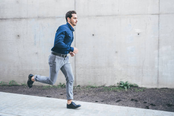 istock young businessman running outdoors in city 1071500766