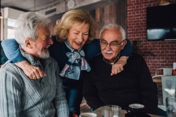 istock Senior friends hugging 1071502166