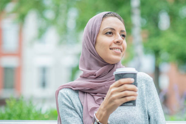 istock Muslim woman enjoys a drink 1071502284