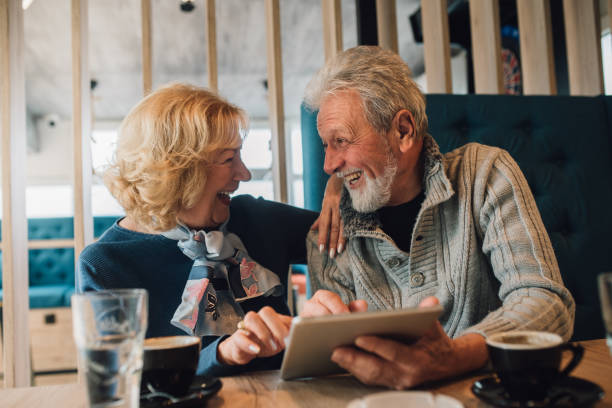 istock Couple with digital tablet looking at each other 1071504350