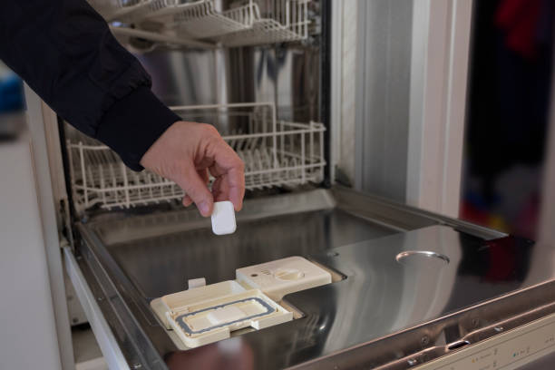 istock Tablets, detergents for the dishwasher. Man shows on pills. 1071509974