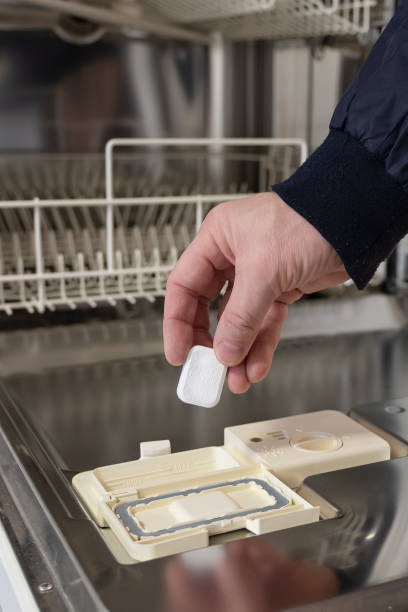 istock Tablets, detergents for the dishwasher. Man shows on pills. 1071509996