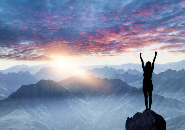 istock Woman Silhouette at sunset on hill 1071511552