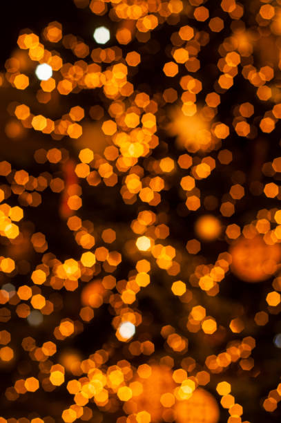 istock festive glittering defocused orange background with bokeh lights 1071523274