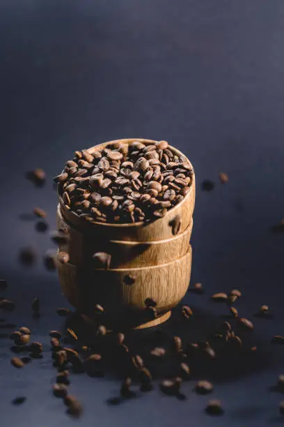 Coffee beans falling into bowl
