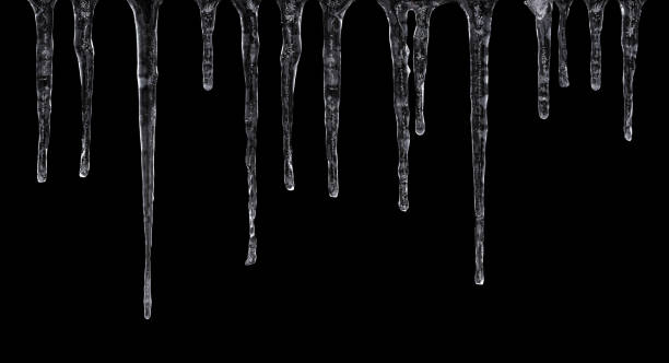 Icicles isolated on black background Close up of icicles isolated on black background icicle photos stock pictures, royalty-free photos & images