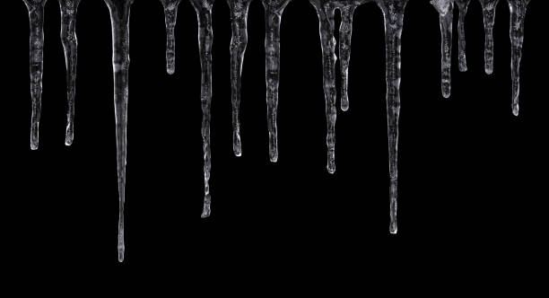 Icicles isolated on black background Close up of icicles isolated on black background icicles melting stock pictures, royalty-free photos & images