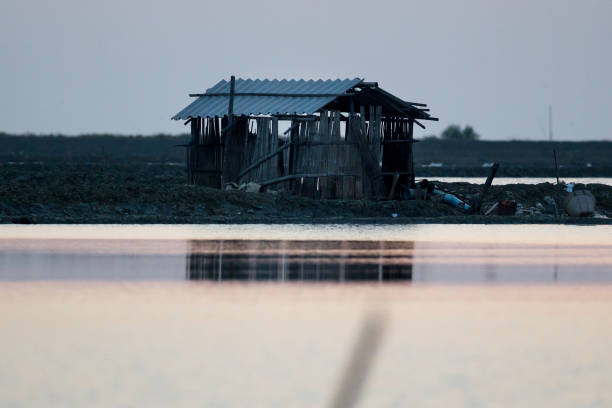 istock The older cottage on sunset in silhouette 1071540982