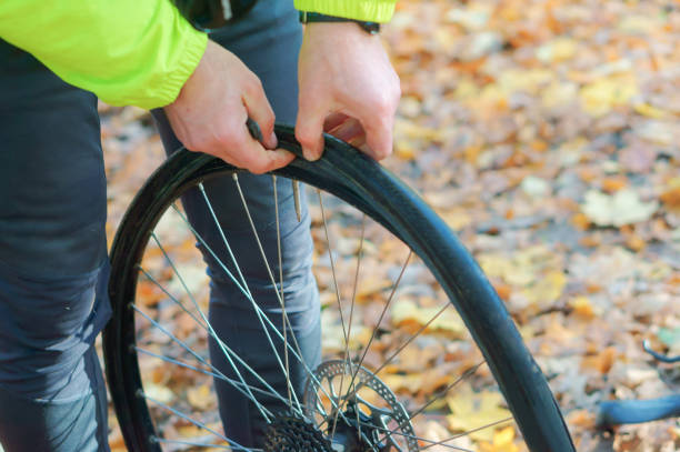 repair the puncture of the bike stock photo