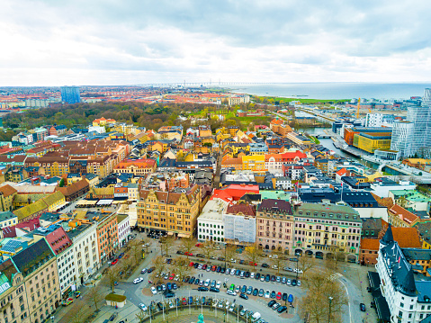 Aerial Malmo city view from above with harbour, turning Torso and the bridge on the horizon