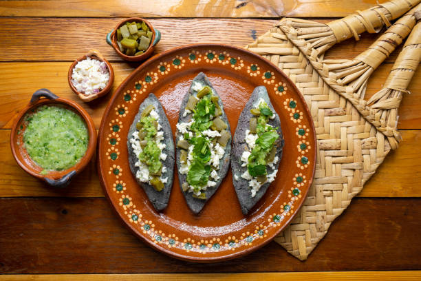 Mexican Tlacoyos With Green Sauce Stock Photo - Download Image Now - Aztec  Civilization, Cactus, Cheese - iStock