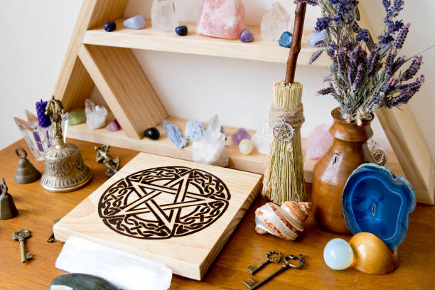 istock Altar decorations with celtic pentacle altar tile, mini besom, herbs and crystals 1071555160