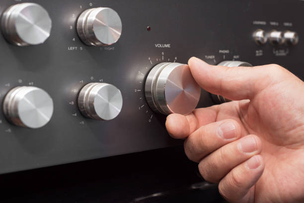istock Hand turning up the volume in a stereo 1071558650