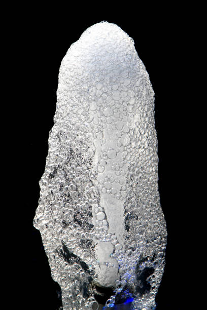 istock water fountain isolated on the black background 1071563592