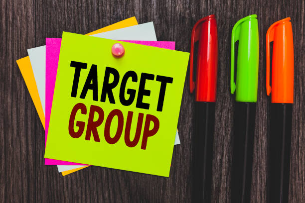 istock Conceptual hand writing showing Target Group. Business photo showcasing Particular people that an advertisement intended to reach to Paper notes Communicate ideas Markers Wooden background. 1071571996