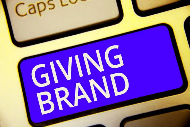 Photo of Conceptual hand writing showing Giving Brand. Business photo showcasing The process of giving a Name to a company products or services Keyboard blue key Intention computer reflection document.