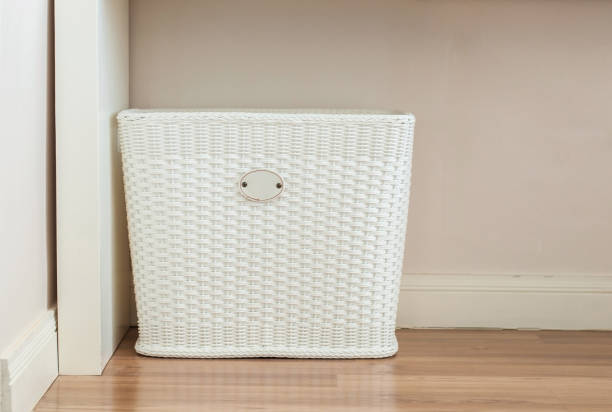 White Cloth basket on floor in room interior