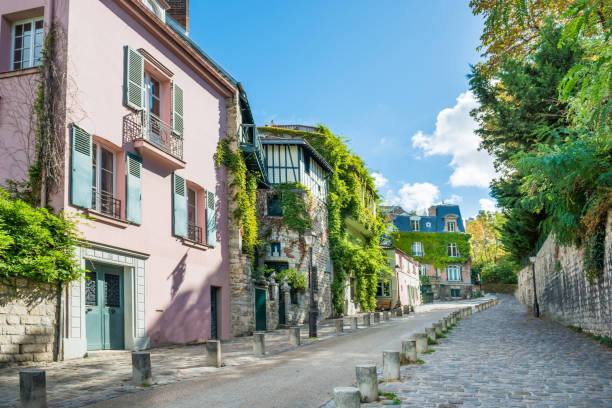 Cozy tourist alley in Paris, Monmartre Cozy tourist alley in Paris, Monmartre street, France montmartre stock pictures, royalty-free photos & images