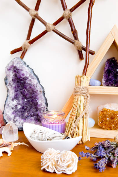 istock Spiritual Altar space with crystal stand, crystals, smudge stick and plain besom 1071579636