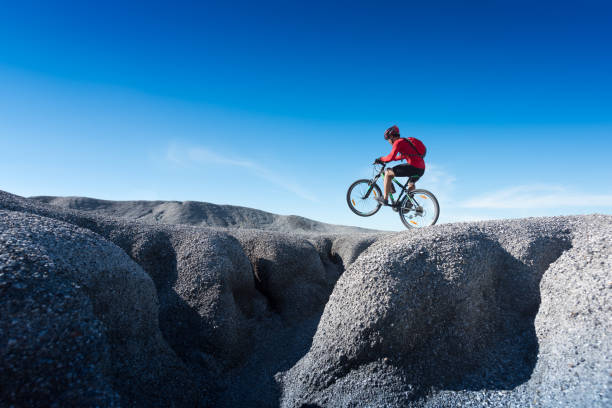 istock Young man riding mountain bike 1071581178