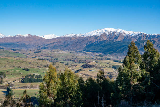 istock Ski fields in the snow capped mountains and valley 1071586824