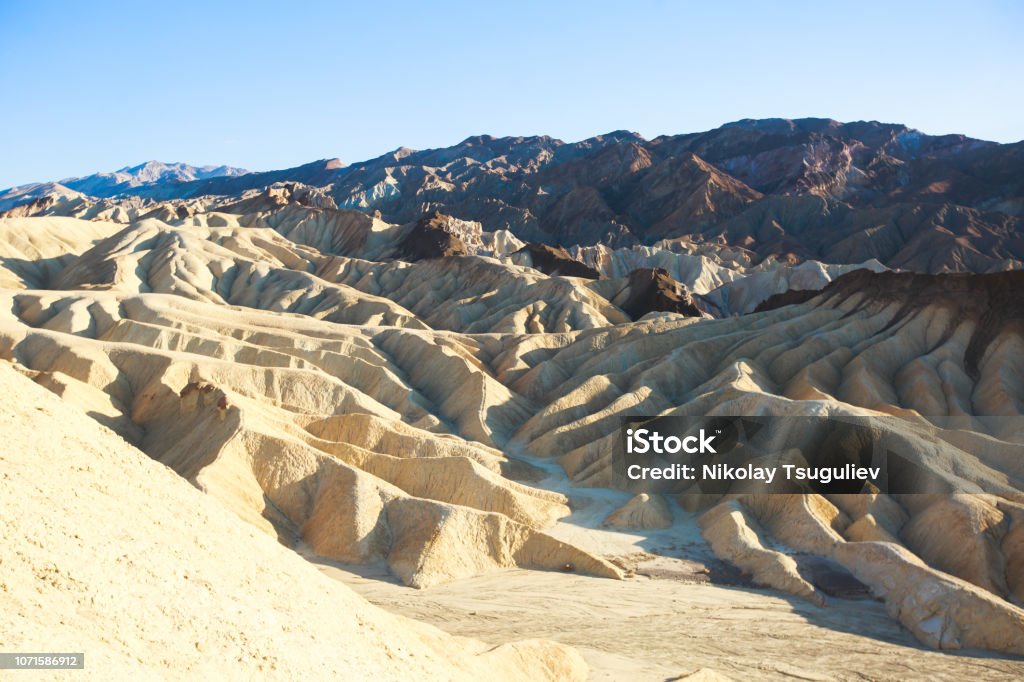 Vibrant panoramic summer view of Zabriskie point badlands in Death Valley National Park, Death Valley, Inyo County, California, USA Vibrant panoramic summer view of Zabriskie point badlands in Death Valley National Park, Death Valley, Inyo County, California, USA"n Arid Climate Stock Photo