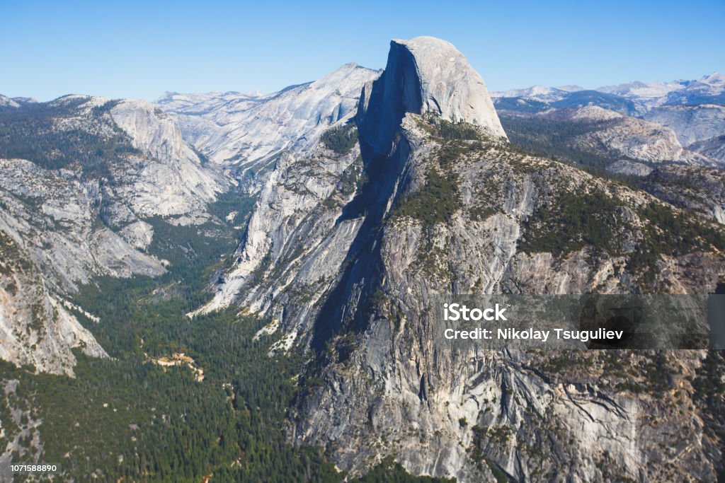 Panoramic summer view of Yosemite valley with Half Dome mountain, Tenaya Canyon, Liberty Cap, Vernal Fall and Nevada Fall, seen from Glacier point overlook, Yosemite National Park, California Panoramic summer view of Yosemite valley with Half Dome mountain, Tenaya Canyon, Liberty Cap, Vernal Fall and Nevada Fall, seen from Glacier point overlook, Yosemite National Park, California"n Architectural Dome Stock Photo