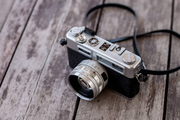 istock Old camera on old wooden background 1071593736