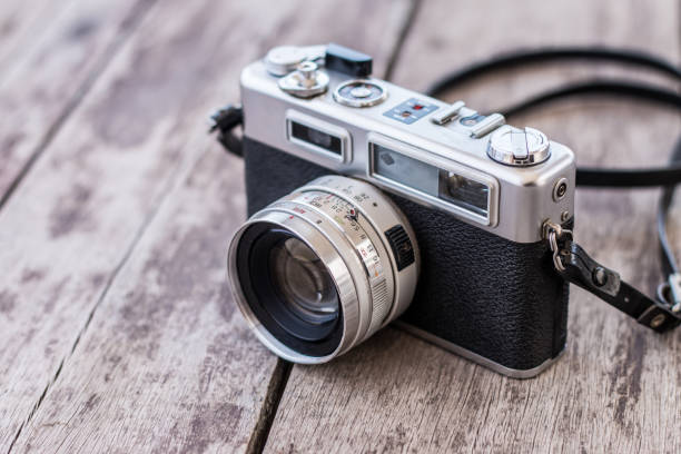 istock Old camera on old wooden background 1071593812