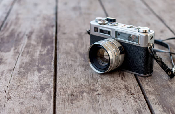 istock Old camera on old wooden background 1071593838