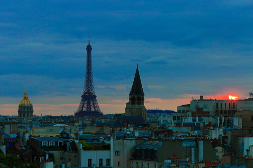 Eiffel Tower and french roofs architecture from above at sunset – Paris, France