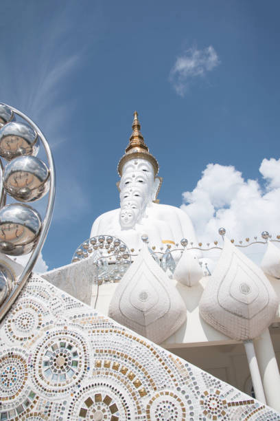 istock Buddha white in Thailand on blue sky background 1071599442