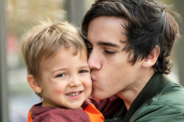 istock Father and son embracing and kissing his son 1071599594