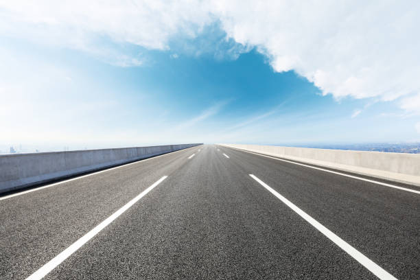 istock Panoramic city skyline and buildings with empty road 1071599784