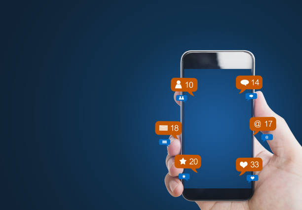 istock Hand holding mobile smart phone, with notification icons and blank empty screen 1071601778