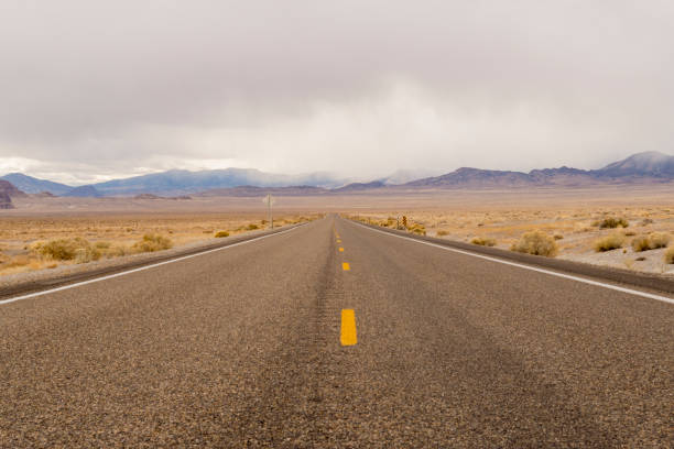 istock Lonely and Empty Desert Road With a Storm Coming 1071601890