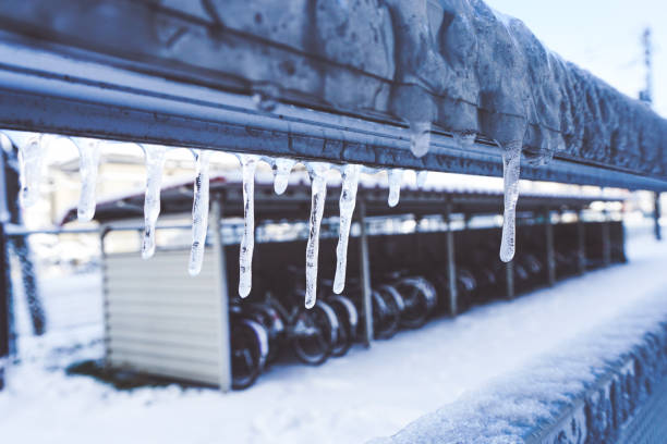 istock Icicle is hanging from a roof 1071602940