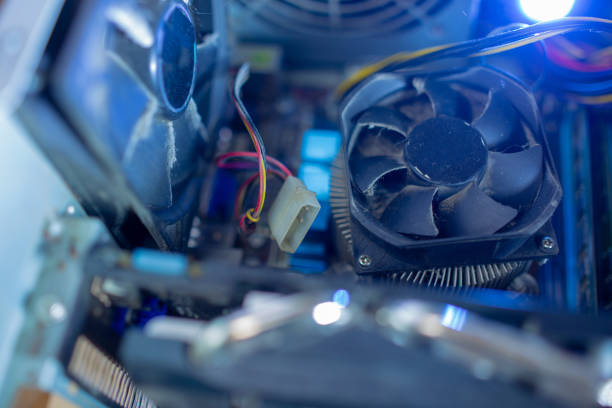istock PC components in dust. macro CPU fan. It does not work, in dust and dirty. 1071618296