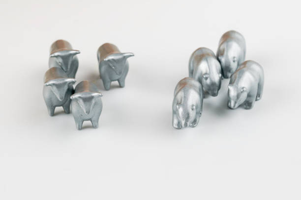 istock bull and bear silver figurine on white background 1071620122