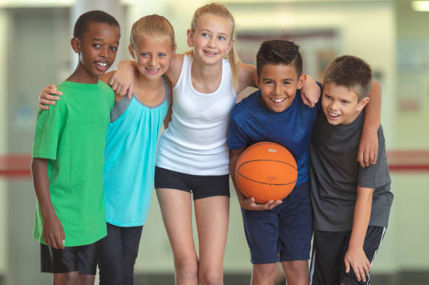 istock Kids playing basketball 1071633386